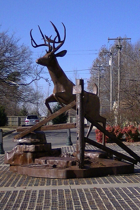 Deer Jumping over a Fence